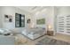 Bright bedroom features a luxurious bed, modern décor, and large windows offering ample natural light at 1540 Hillview Dr, Sarasota, FL 34239