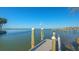 Wooden dock featuring sturdy pilings, a modern lighting fixture and endless water views at 1540 Hillview Dr, Sarasota, FL 34239