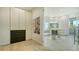 Bright Dressing Room, featuring a glass door that goes to a contemporary bathroom at 1540 Hillview Dr, Sarasota, FL 34239