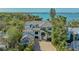Beautiful waterfront home with lush tropical landscaping, multi-car garage and a grand staircase entrance at 1540 Hillview Dr, Sarasota, FL 34239