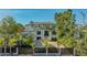 Elegant two-story home features a gated entrance, manicured landscaping and a driveway leading to the home at 1540 Hillview Dr, Sarasota, FL 34239