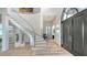 Bright and airy entryway with a grand staircase, high ceilings, and elegant finishes, creating a welcoming atmosphere at 1540 Hillview Dr, Sarasota, FL 34239