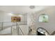 Grand foyer featuring a winding staircase, modern chandelier, and unique architecture for a luxurious entrance at 1540 Hillview Dr, Sarasota, FL 34239