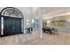 The grand foyer showcases a dramatic black double door entry, with an adjacent dining space and wood flooring at 1540 Hillview Dr, Sarasota, FL 34239