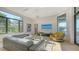 Bright living room showcasing modern furniture, large windows with water views, and contemporary decor at 1540 Hillview Dr, Sarasota, FL 34239
