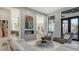 Contemporary living room featuring a fireplace, modern seating, and seamless access to outdoor space at 1540 Hillview Dr, Sarasota, FL 34239