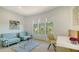 Bright living room with ample seating, stylish decor, and natural light streaming through large windows at 1540 Hillview Dr, Sarasota, FL 34239