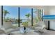 Bright living room featuring large windows with picturesque water views, creating a serene and inviting atmosphere at 1540 Hillview Dr, Sarasota, FL 34239