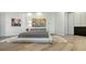 Modern main bedroom featuring a unique platform bed, contemporary artwork, and sleek minimalist design at 1540 Hillview Dr, Sarasota, FL 34239