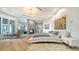 Modern main bedroom boasts a unique platform bed, fireplace, ensuite and lots of wall art at 1540 Hillview Dr, Sarasota, FL 34239