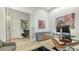 Modern office features contemporary artwork, a glass desk, and comfortable seating in a well-lit space at 1540 Hillview Dr, Sarasota, FL 34239