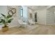 Sitting room with modern decor, light hardwood floors, and bright natural light coming through the window at 1540 Hillview Dr, Sarasota, FL 34239