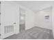 This bedroom features gray carpet, and one window at 164 Eagleston Ln, Sarasota, FL 34240