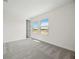 This bright bedroom boasts gray carpet and two bright windows at 164 Eagleston Ln, Sarasota, FL 34240