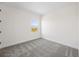 Neutral bedroom with gray carpet, white walls, and a window with a view at 164 Eagleston Ln, Sarasota, FL 34240