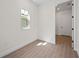 This bedroom features tile flooring, white walls and a bright window at 164 Eagleston Ln, Sarasota, FL 34240