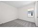 This light-filled bedroom is complete with plush carpeting and a bright window at 164 Eagleston Ln, Sarasota, FL 34240