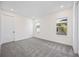 This primary bedroom features neutral decor, carpet, and abundant natural light from two windows at 164 Eagleston Ln, Sarasota, FL 34240