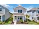 Charming two-story home with manicured lawn and inviting front porch at 164 Eagleston Ln, Sarasota, FL 34240