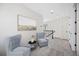 Bright second floor landing with two chairs and nice artwork at 164 Eagleston Ln, Sarasota, FL 34240