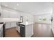 Bright kitchen features stainless steel appliances, island with sink and open layout at 164 Eagleston Ln, Sarasota, FL 34240