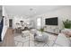 Bright living room with open floor plan connected to modern kitchen and dining area at 164 Eagleston Ln, Sarasota, FL 34240