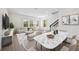 Open-concept living space with bright, natural light, stylish decor, and staircase at 164 Eagleston Ln, Sarasota, FL 34240