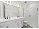 Sleek bathroom with double vanity, frameless glass shower, and modern fixtures at 164 Eagleston Ln, Sarasota, FL 34240