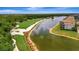 Breathtaking aerial of the golf course and lake surrounding the waterfront condos at 17118 Vardon Ter # 101, Bradenton, FL 34211