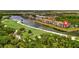Gorgeous aerial showcasing the waterfront condos overlooking the golf course at 17118 Vardon Ter # 101, Bradenton, FL 34211