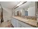 Spacious bathroom with double sinks, granite countertop, and a shower-tub combination at 17118 Vardon Ter # 101, Bradenton, FL 34211