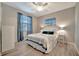 Comfortable bedroom with a large window, plush bedding, and ample closet space at 17118 Vardon Ter # 101, Bradenton, FL 34211