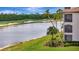 Wonderful exterior view from the screened in lanai of the golf course and lake at 17118 Vardon Ter # 101, Bradenton, FL 34211