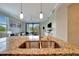 Beautiful kitchen with stainless steel sink overlooking living room and lanai at 17118 Vardon Ter # 101, Bradenton, FL 34211