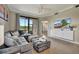 Spacious living room with sliding glass doors leading to a balcony, with views of the bedroom visible at 17118 Vardon Ter # 101, Bradenton, FL 34211