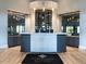 The lobby has a large reception desk, wine display and modern lighting at 17118 Vardon Ter # 101, Bradenton, FL 34211