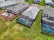 Aerial view displays the backyard with screened-in pool and lush green lawn, enclosed by a defined property line at 17502 Savory Mist Cir, Bradenton, FL 34211