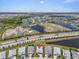 Beautiful aerial view of a home in a scenic community with ponds and lush landscaping at 17502 Savory Mist Cir, Bradenton, FL 34211