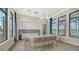 Clubhouse bar area with seating, wine fridge, and cabinets at 17502 Savory Mist Cir, Bradenton, FL 34211