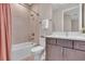 Bathroom features a bathtub, shower, and updated vanity at 17502 Savory Mist Cir, Bradenton, FL 34211
