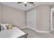 Comfortable bedroom with a ceiling fan, closet, and neutral decor at 17502 Savory Mist Cir, Bradenton, FL 34211