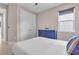 Bedroom with large window, closet, and ceiling fan for added comfort at 17502 Savory Mist Cir, Bradenton, FL 34211