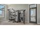 Fitness center featuring weight training equipment, and a view of the outdoor green space at 17502 Savory Mist Cir, Bradenton, FL 34211
