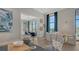 Open concept lounge with stylish seating, modern art, and lots of natural light at 17502 Savory Mist Cir, Bradenton, FL 34211