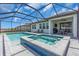 Screened-in outdoor pool with a separate spa, seating, and summer kitchen at 17502 Savory Mist Cir, Bradenton, FL 34211