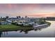 Aerial view of community amenities including pool, tennis courts and lakefront access, perfect for leisure at 18044 Cherished Loop, Bradenton, FL 34211