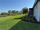 Spacious backyard featuring green lawn and privacy landscaping, ideal for outdoor activities and relaxation at 18044 Cherished Loop, Bradenton, FL 34211