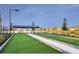 Outdoor bocce ball court with seating and views of the lake and surrounding residential area at 18044 Cherished Loop, Bradenton, FL 34211