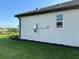 Exterior home featuring modern utilities, neutral paint and green lawn providing a well-kept curb appeal at 18044 Cherished Loop, Bradenton, FL 34211