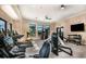Well-equipped gym featuring modern treadmills, weight machines, and free weights for a comprehensive workout experience at 18044 Cherished Loop, Bradenton, FL 34211